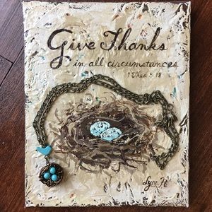 Antique brass necklace with bird and birds nest.